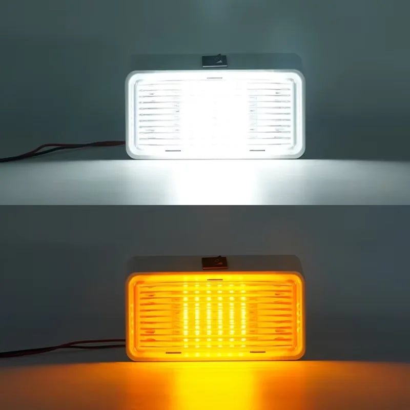 Two rectangular LED lights, one white and one orange, on a gray background.
