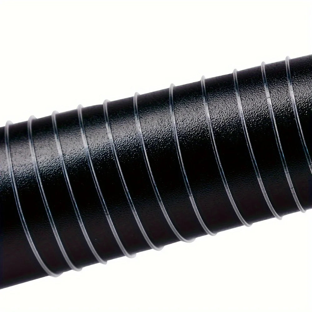 Close-up of a black rubber hose with ribbed texture on a white background
