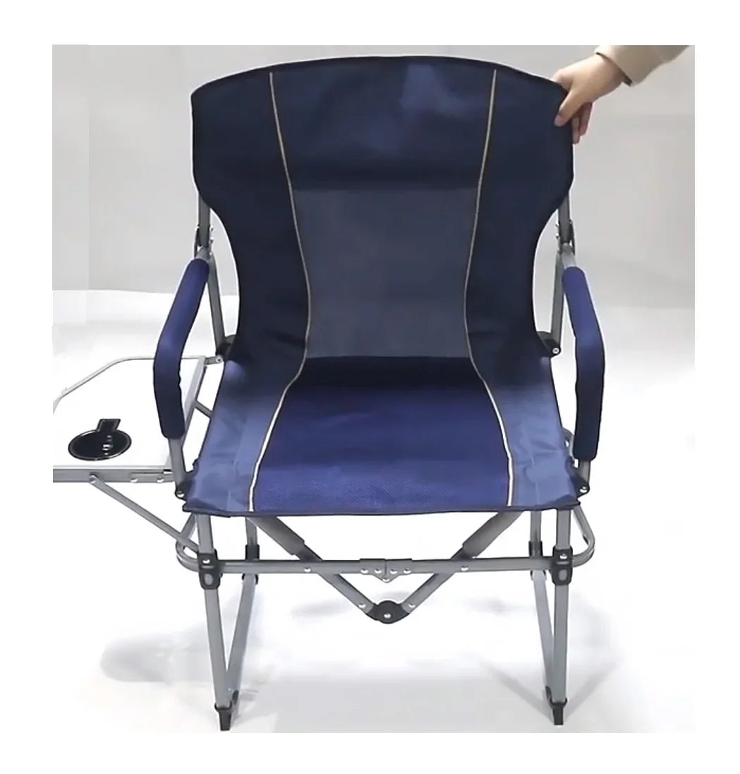 Blue camping chair with a person adjusting the backrest on a white background