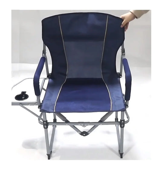 Blue camping chair with a person adjusting the backrest on a white background