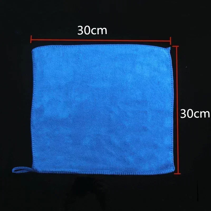 Blue towel with dimensions labeled on a black background