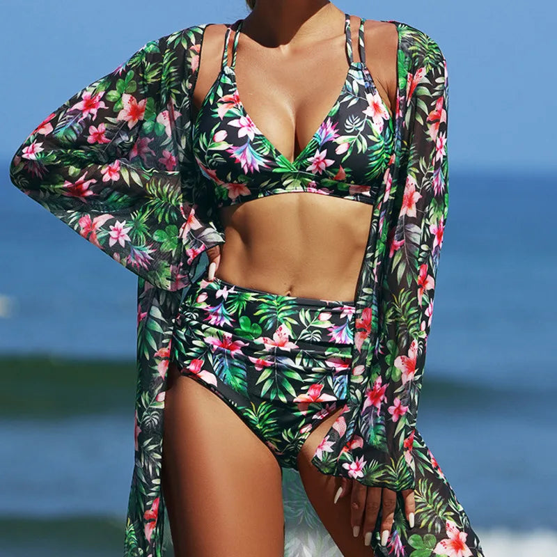 Woman wearing a floral bikini and cover-up on a beach