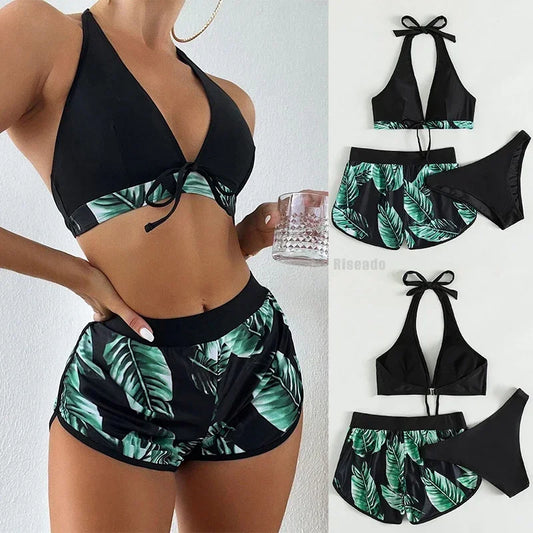 Black and green leaf-patterned two-piece swimsuit with a person wearing it.