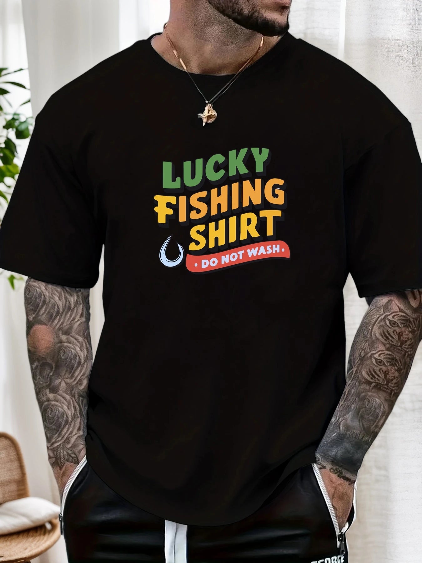 Person wearing a black t-shirt with 'Lucky Fishing Shirt Do Not Wash' text.