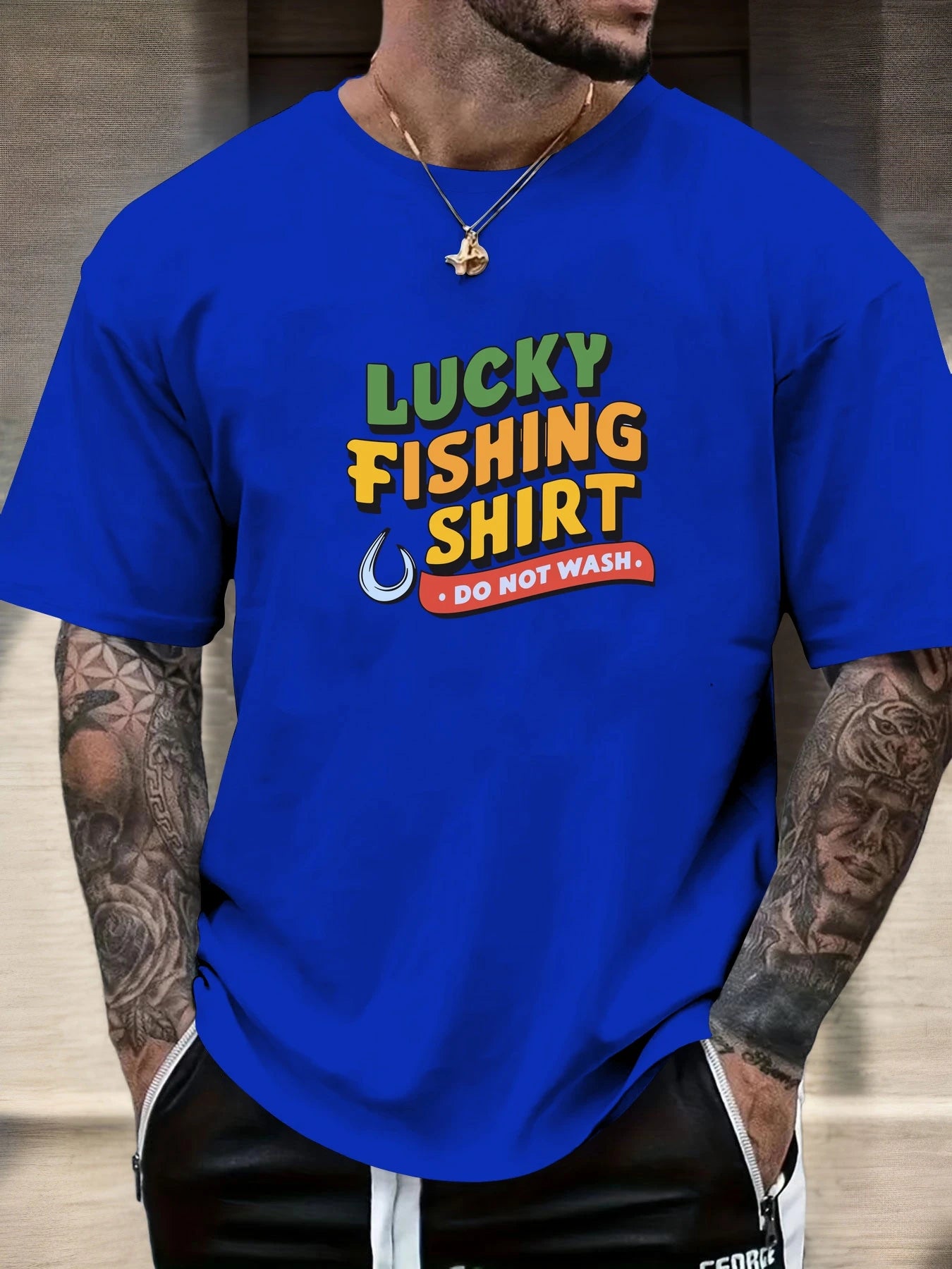Person wearing a blue t-shirt with 'Lucky Fishing Shirt Do Not Wash' text.