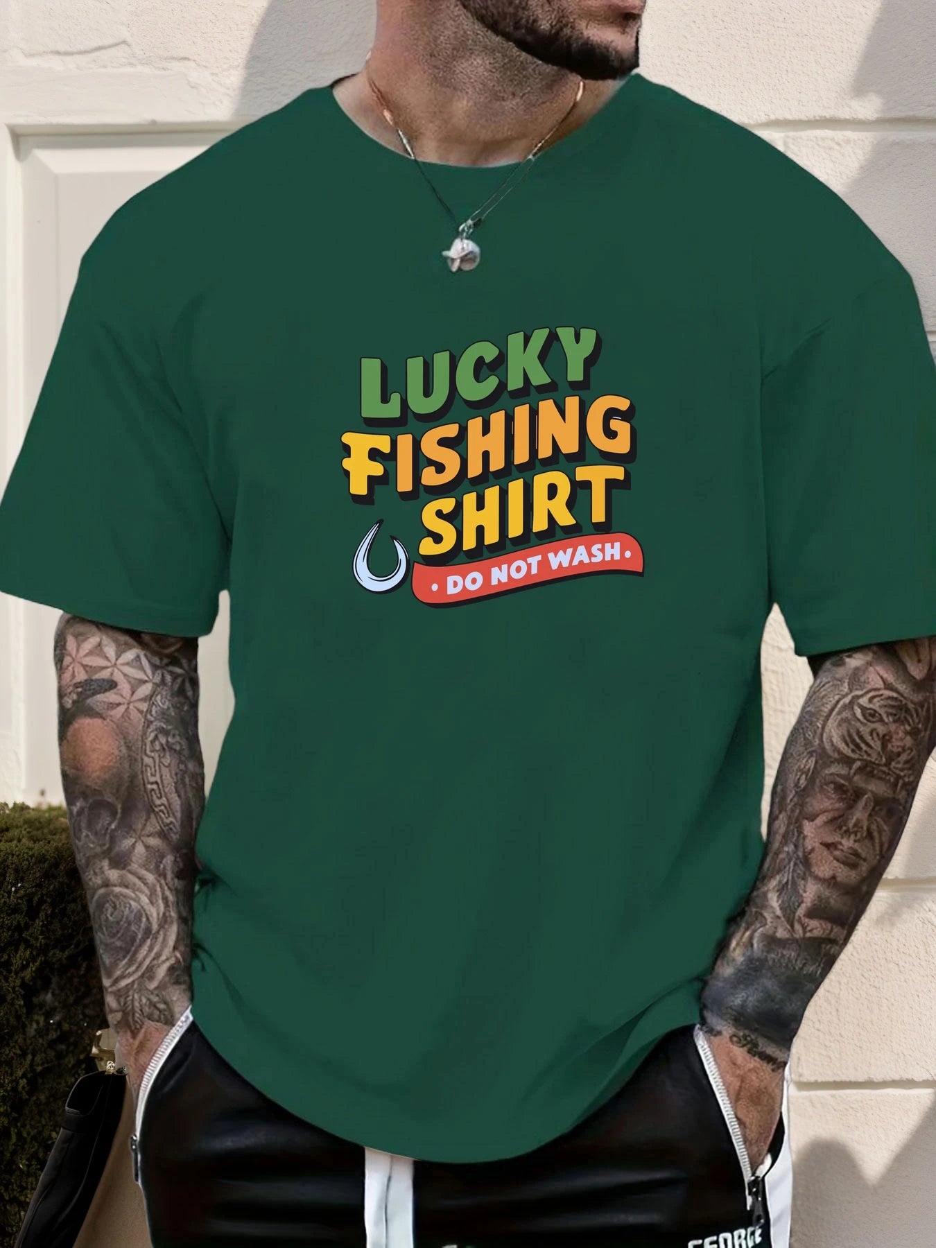 Person wearing a green t-shirt with 'Lucky Fishing Shirt Do Not Wash' text.