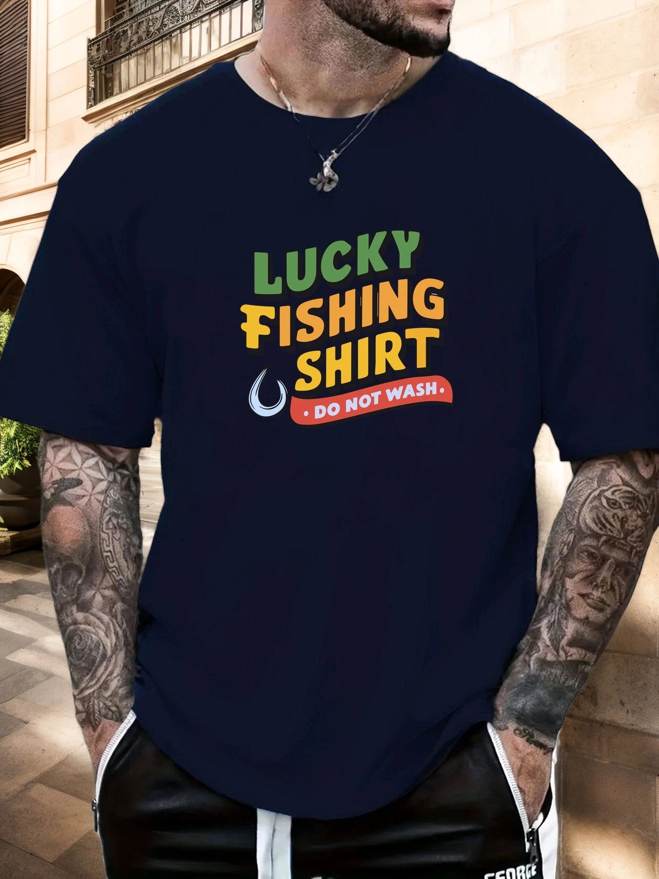 Person wearing a navy blue t-shirt with 'Lucky Fishing Shirt Do Not Wash' text.