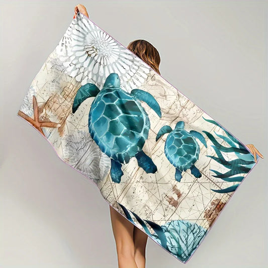 Person holding a towel with turtle design against a plain background