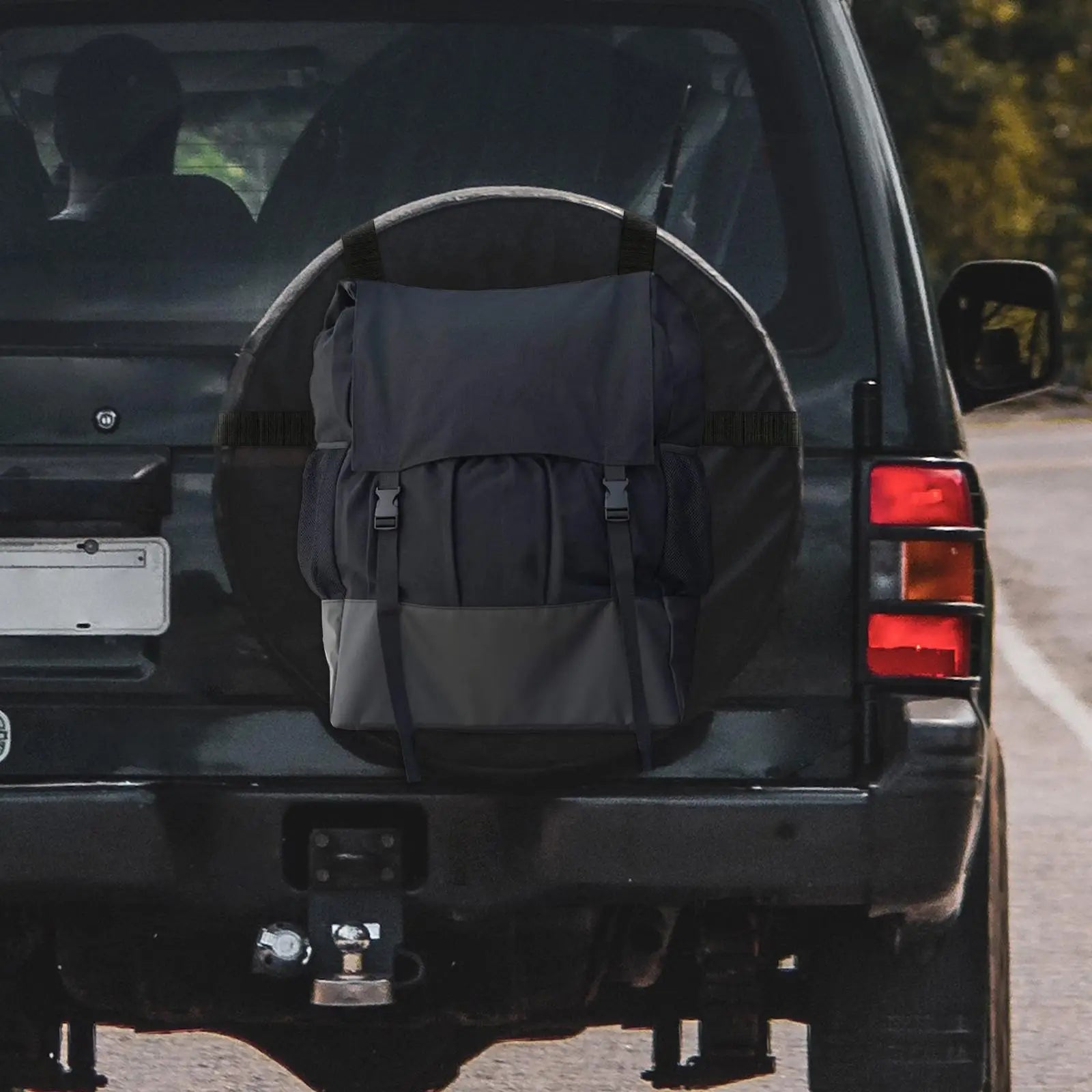 Black and gray backpack on the back of a black SUV