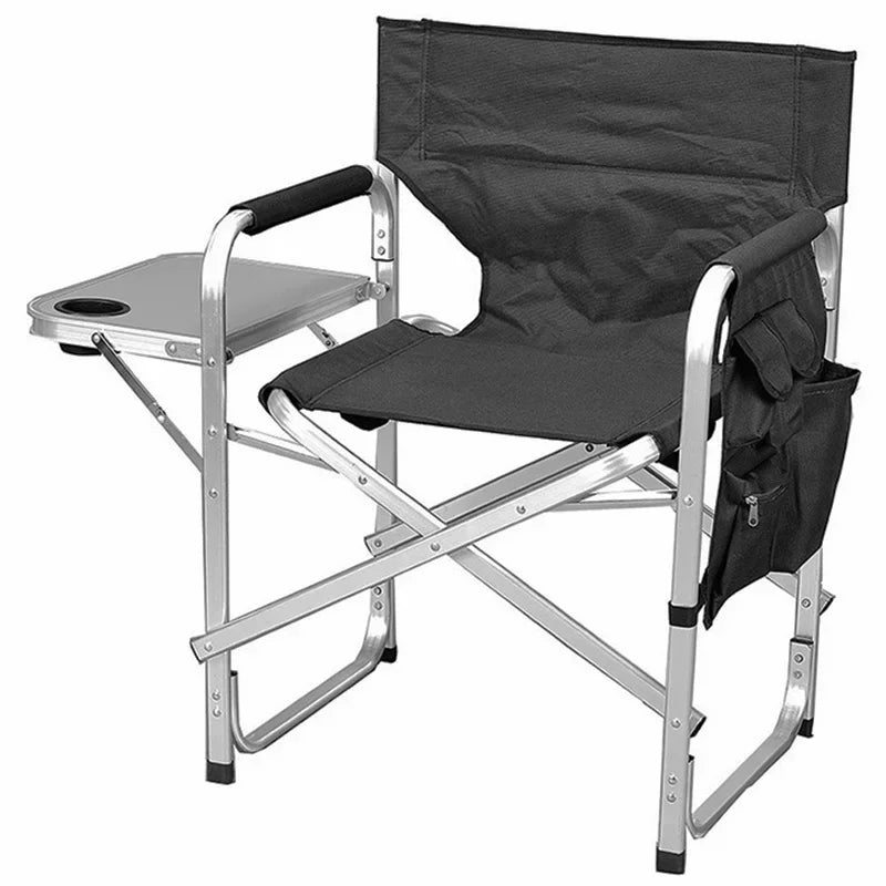 Black folding chair with a small table on a white background