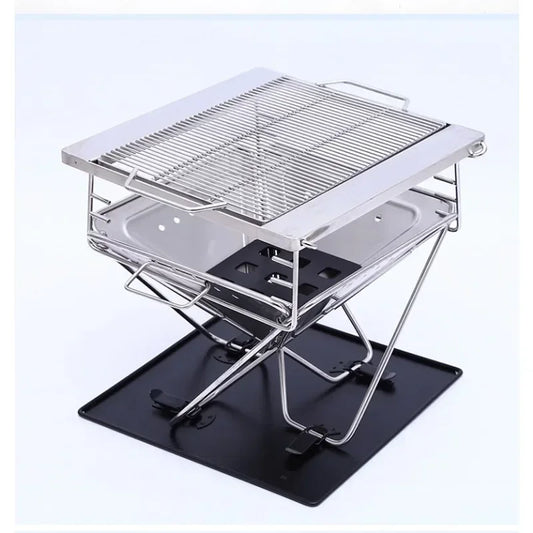 Portable metal grill on a white background