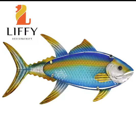 Handcrafted metal fish wall decor with stained glass elements for outdoor beach and poolside spaces.