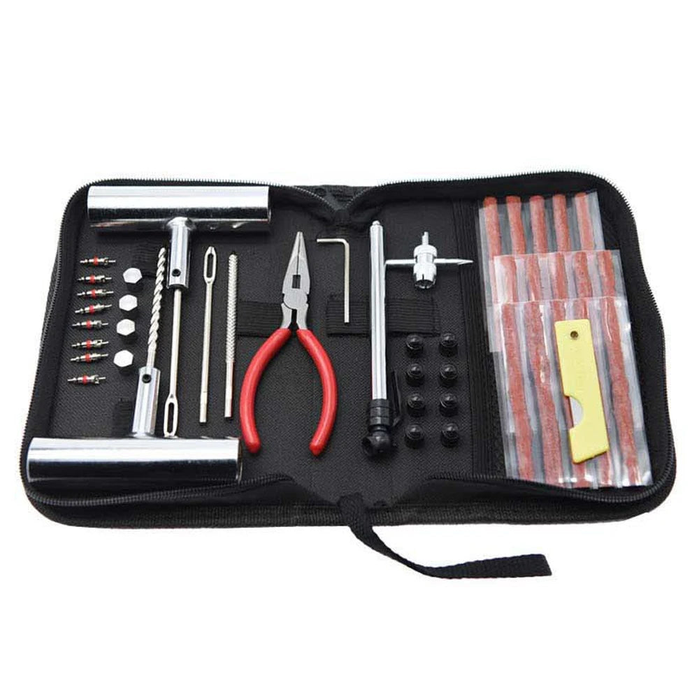 Tool kit with various utensils in a black case on a white background