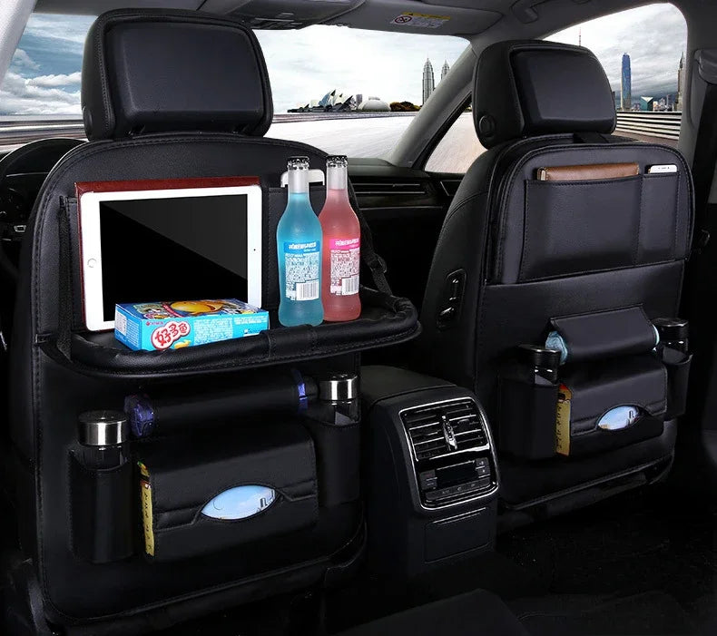 Car backseat organizer with tablet, drinks, and snacks in a vehicle interior.