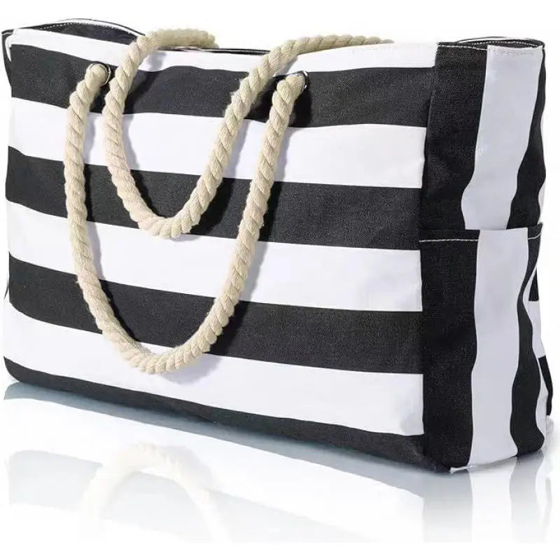 Black and white striped tote bag with rope handles on a white background