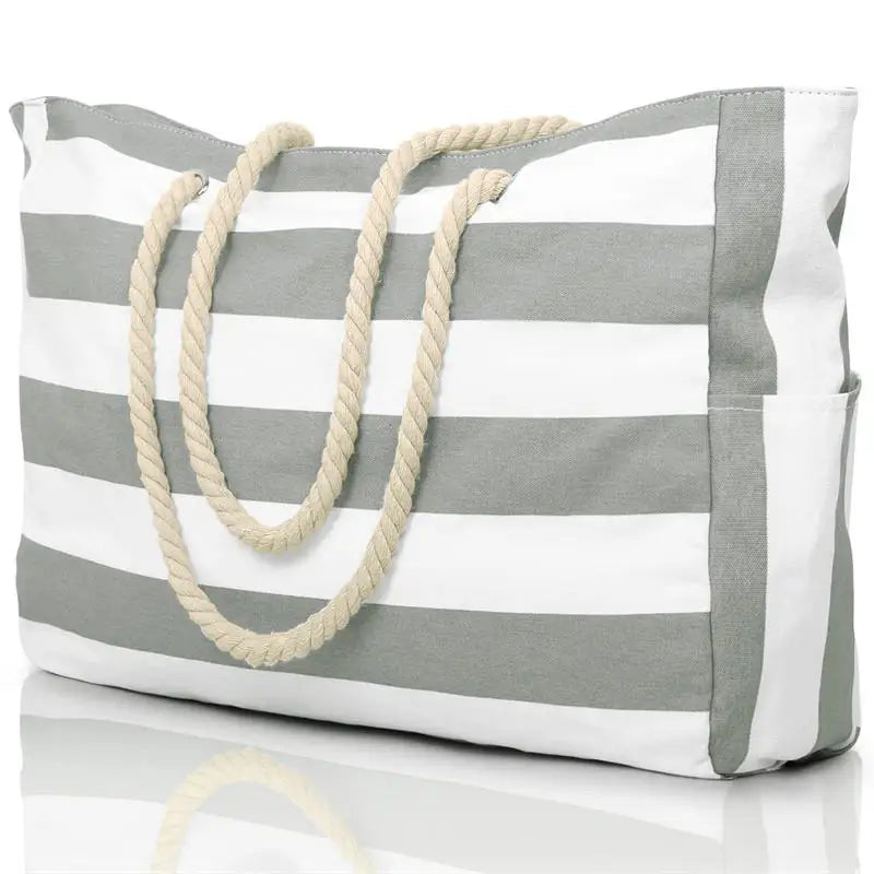 Gray and white striped tote bag with rope handles on a white background