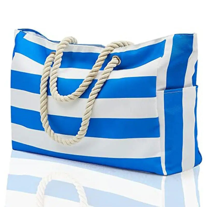 Blue and white striped tote bag with rope handles on a light blue background