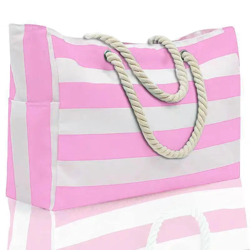 Pink and white striped tote bag with rope handles on a white background