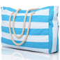 Blue and white striped tote bag with rope handles on a reflective surface