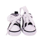 Pair of black and white shoes on a white background