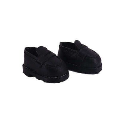 Pair of black shoes with velcro straps on a white background