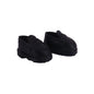 Pair of black shoes with velcro straps on a white background