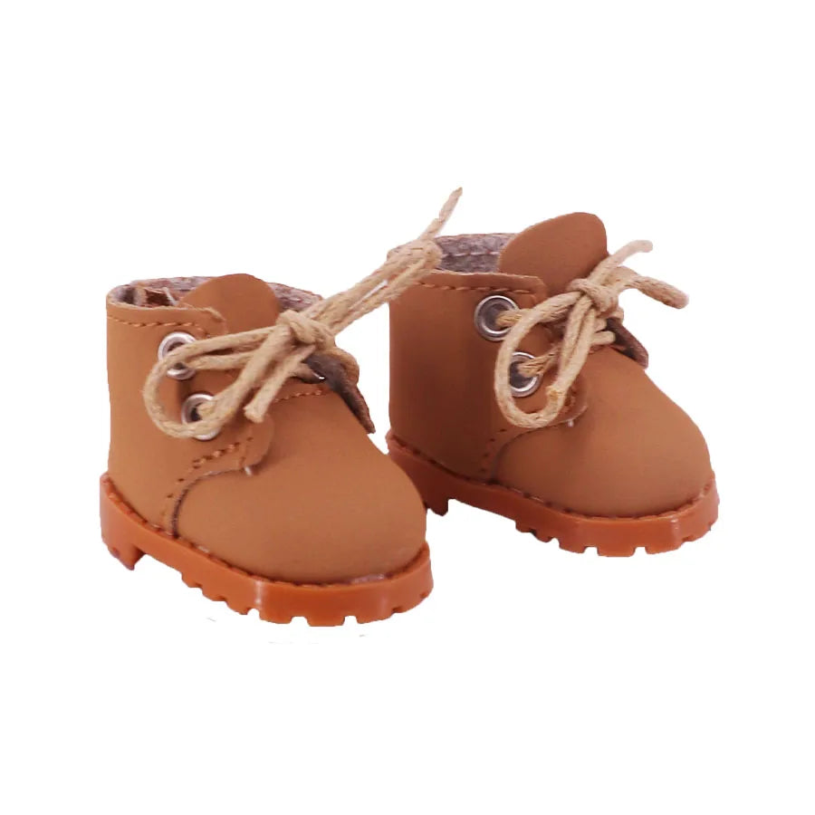Pair of brown baby boots with laces on a white background