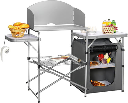Portable camping kitchen with shelves and food items on a white background