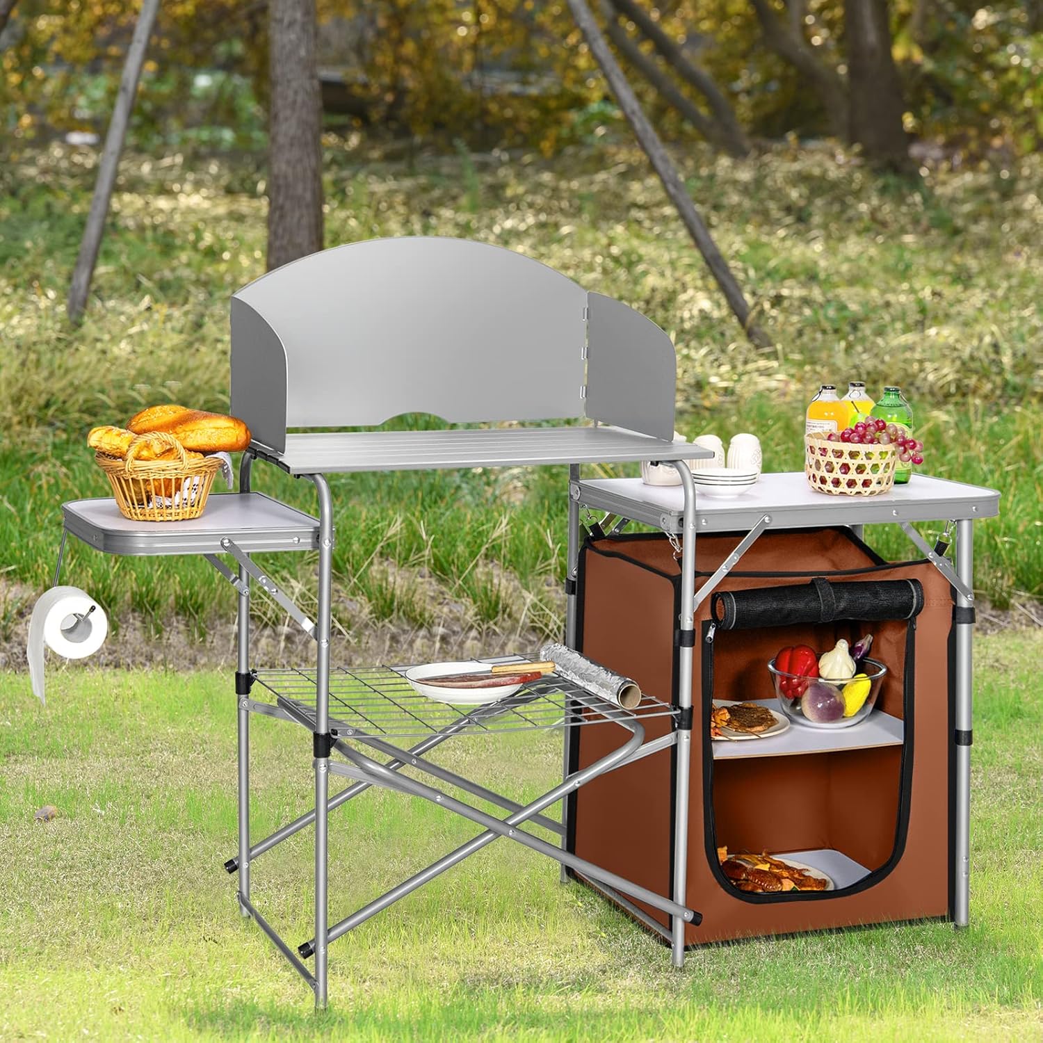 Portable outdoor kitchen with seating area in a grassy area