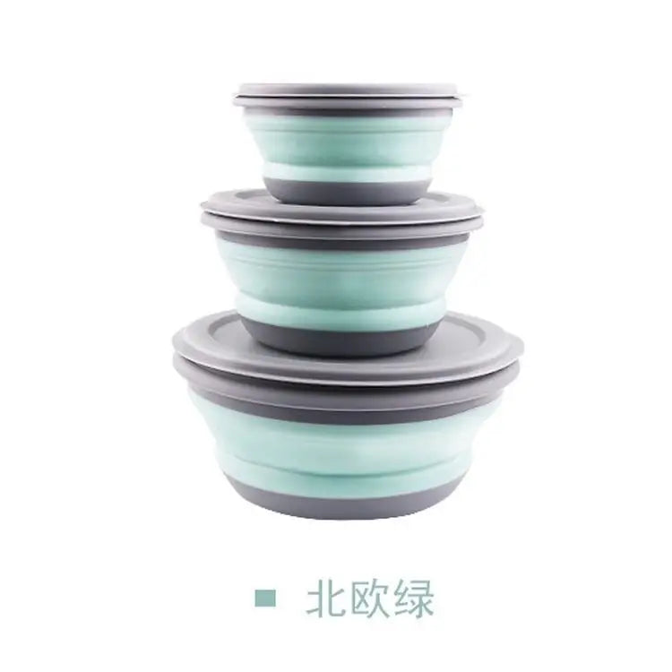 Set of three collapsible bowls in green and gray on a white background