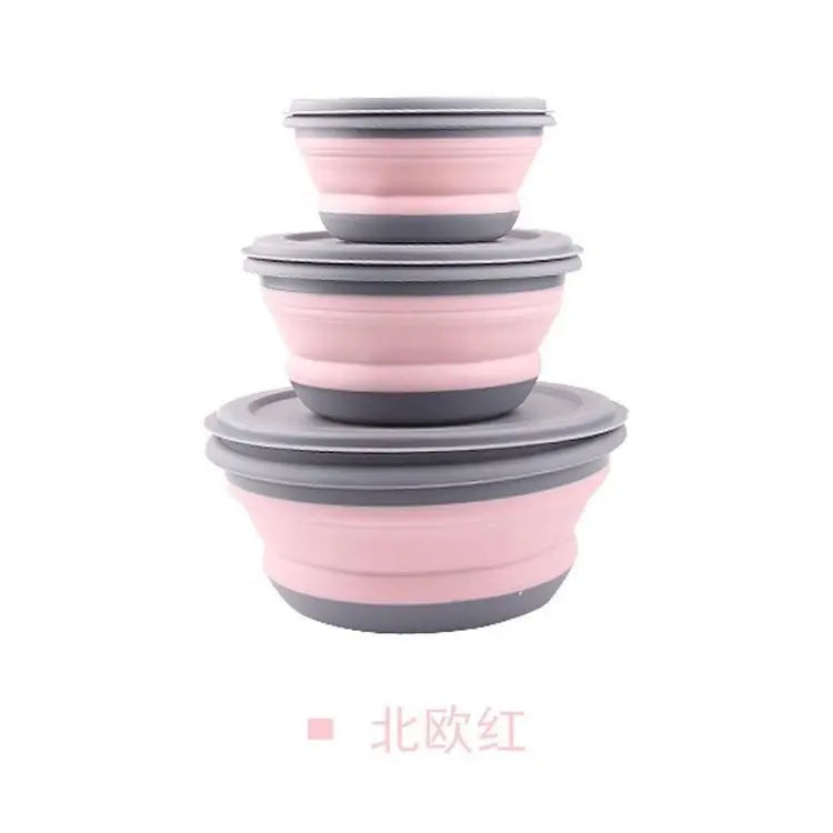 Set of pink and gray collapsible bowls on a white background