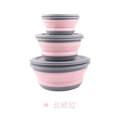 Set of pink and gray collapsible bowls on a white background