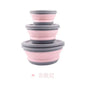 Set of pink and gray collapsible bowls on a white background