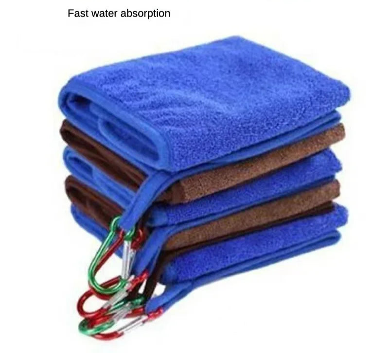 Stack of blue and brown fishing towels with carabiners on a white background