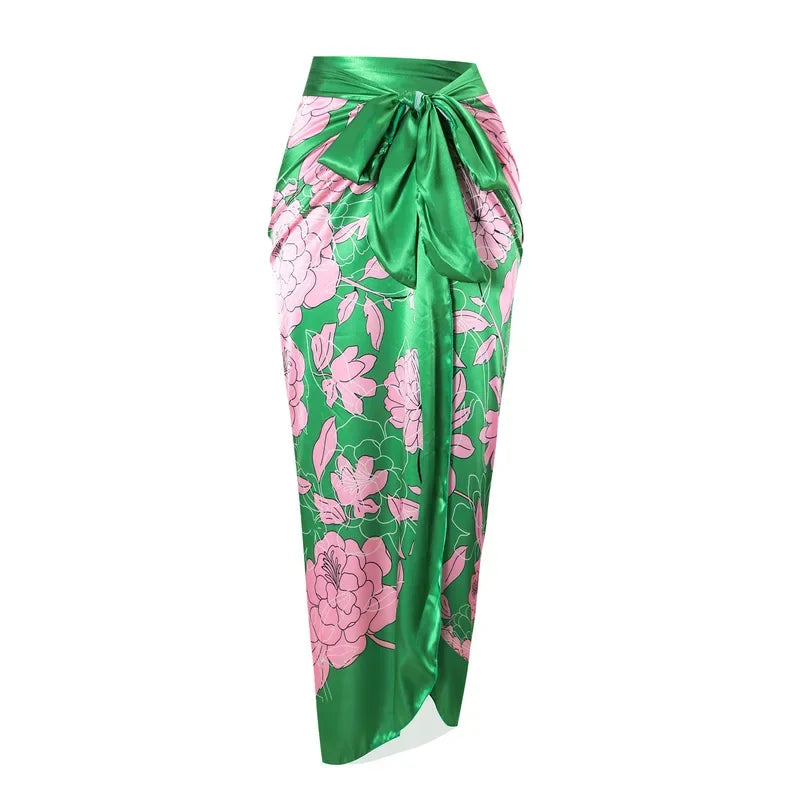 Green and pink floral patterned skirt on a white background