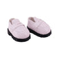 Pair of pink loafers with black soles on a white background