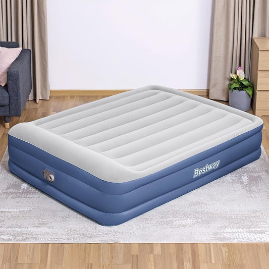 Inflatable air mattress with Bestway logo on a wooden floor in a room.