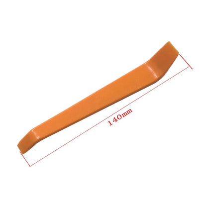 Orange plastic tool with measurement details on a white background