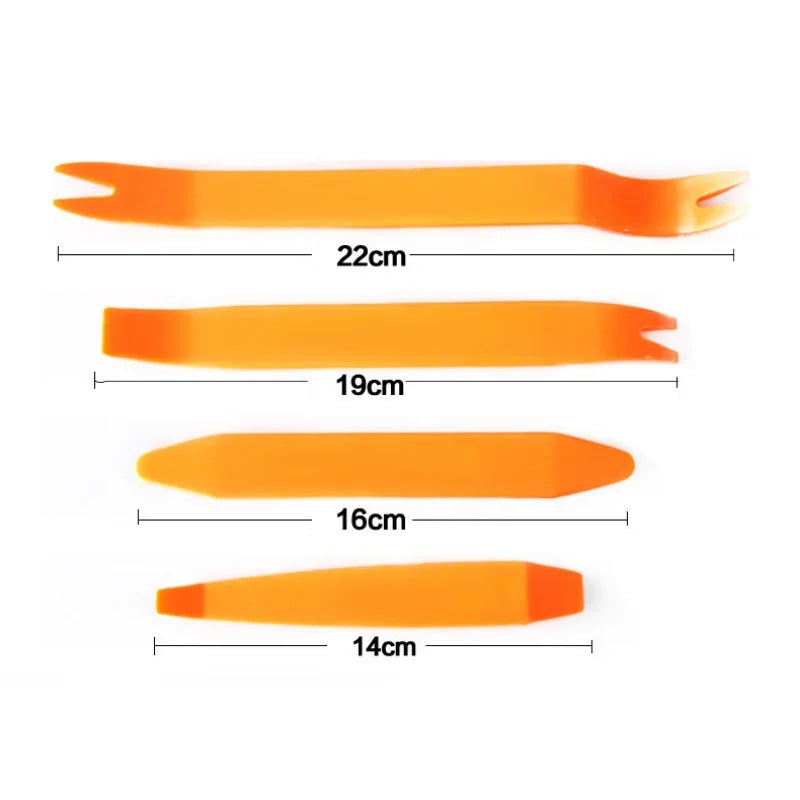 Set of orange plastic tools with measurements on a white background