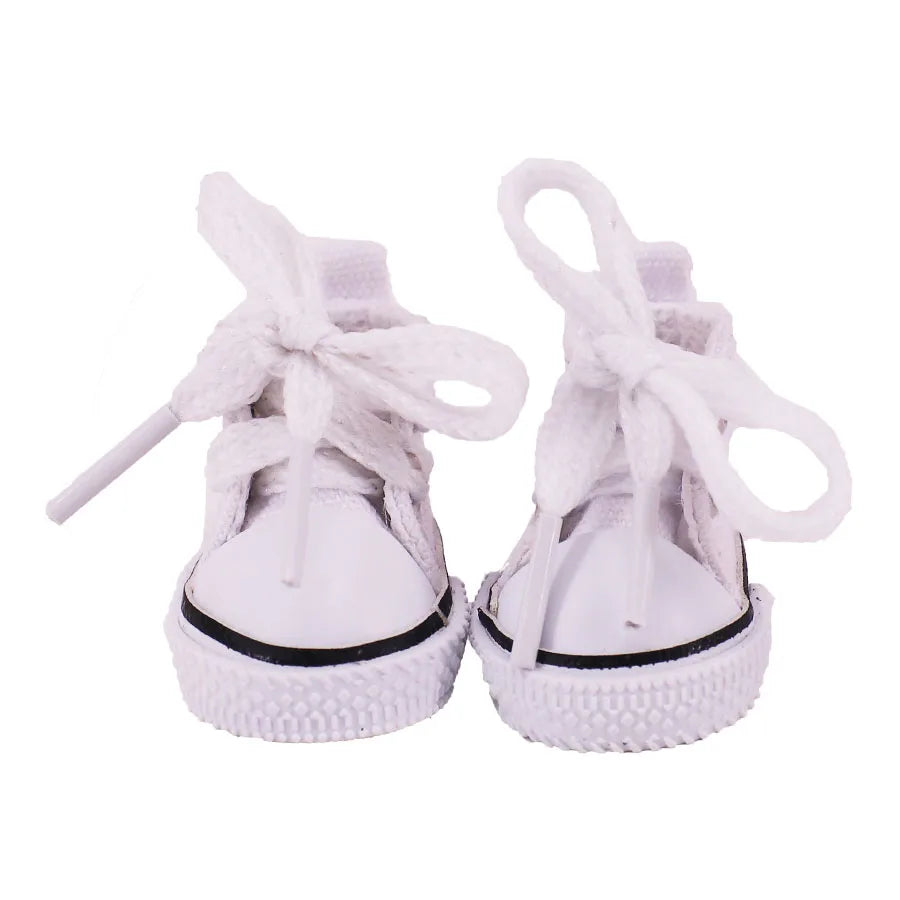 White  shoes with black soles on a white background
