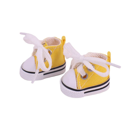 Yellow high-top sneakers with white laces on a white background